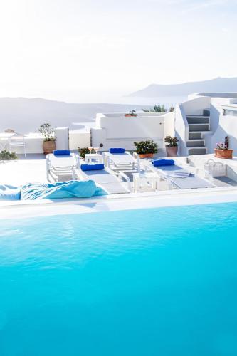 a rendering of a pool with chairs and water at Pantelia Suites in Fira