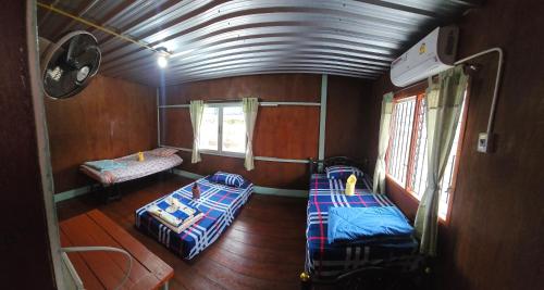 Postel nebo postele na pokoji v ubytování Lungmin homestay