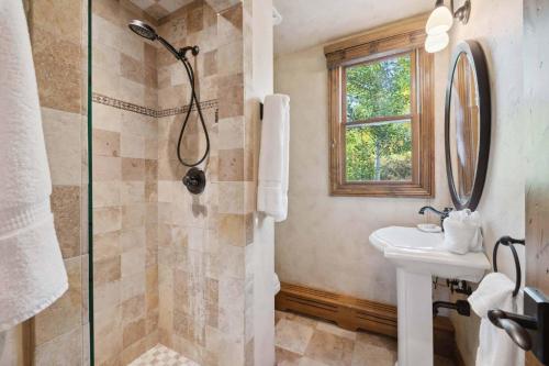 a bathroom with a shower and a sink at Woodrun Place 11 in Snowmass