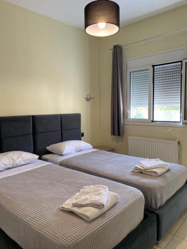 Ένα ή περισσότερα κρεβάτια σε δωμάτιο στο lefkoma