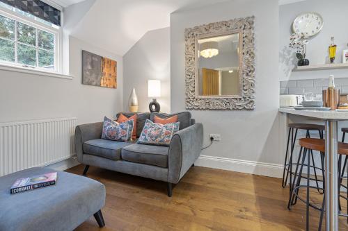 a living room with a chair and a table at No 3 - Lime Tree Cottage - Pass the Keys in York