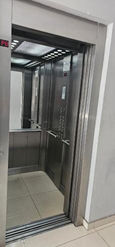 an elevator in a building with its doors open at Palermo Apart 3 in Buenos Aires