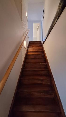a staircase in a house with wooden floors at WesterOurthe 6 personen Sauna in Durbuy