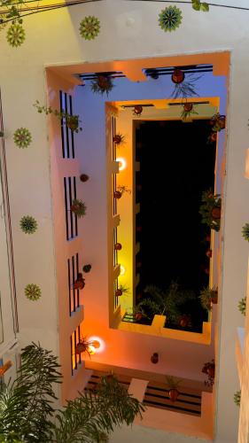 a mirror on a wall in a room at Hotel Rising Star in Pushkar