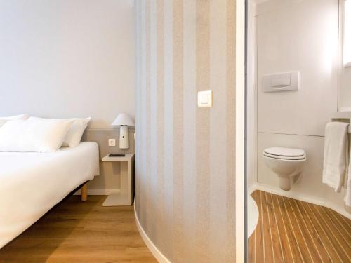 Postel nebo postele na pokoji v ubytování Ibis Valencia Alfafar