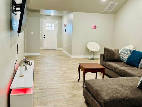 a living room with a couch and a table at Come n find out! Breathtaking! in Lawton