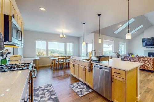 a kitchen and living room with a counter top at Heaven on Hemlock in Union