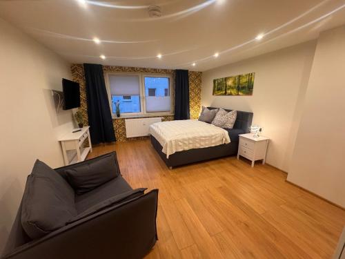 Ένα ή περισσότερα κρεβάτια σε δωμάτιο στο Oneo-Plaza-Apartments