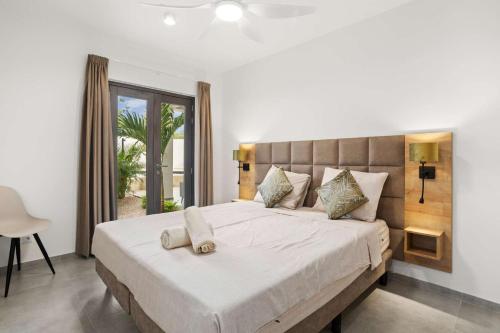 Ένα ή περισσότερα κρεβάτια σε δωμάτιο στο Bonaire Beach Apartment 3 with communal pool and diving facilities