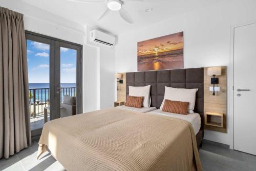 Ένα ή περισσότερα κρεβάτια σε δωμάτιο στο Bonaire Beach Apartment 10 with communal pool and diving facilities