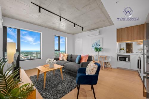 a living room with a couch and a table at WOW Apartment on Hancock Southbank in Melbourne