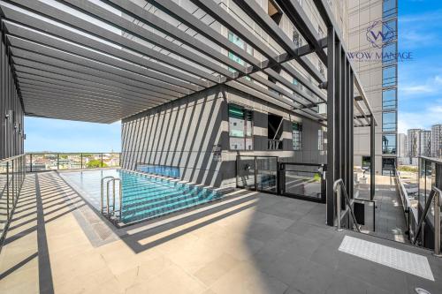 a view of a building with a swimming pool at WOW Apartment on Hancock Southbank in Melbourne