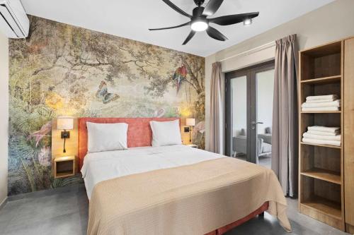 a bedroom with a large bed with a painting on the wall at Bonaire Beach Apartment 12 with communal pool and diving facilities in Kralendijk