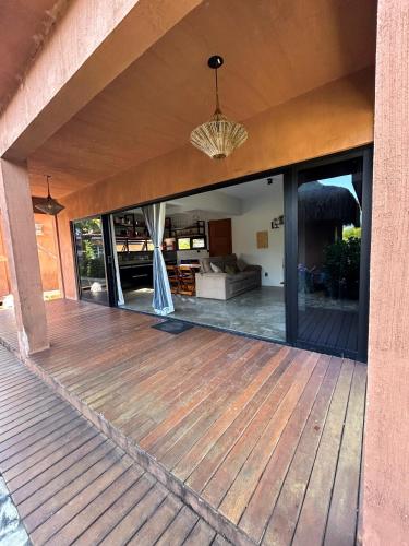 an open deck with a view of the living room at Barong EcoVilla in Barra Grande