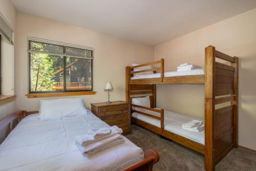a bedroom with two bunk beds and a window at Shasky Retreat in Dorrington