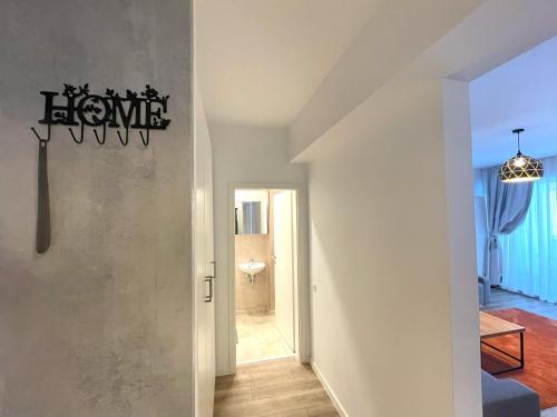 a hallway leading to a bathroom in a house at Lumial Mountain Nest in Braşov
