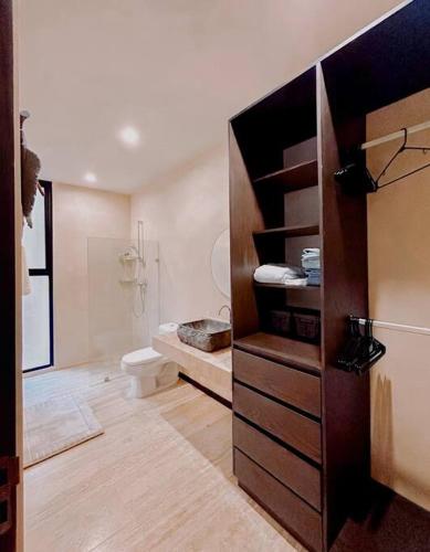 a bathroom with a toilet and a sink at New Loft! Jungle Gym Best Pool in Tulum