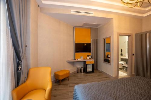 a hotel room with a bed and a bathroom at Icon Hotel Bomonti in Istanbul