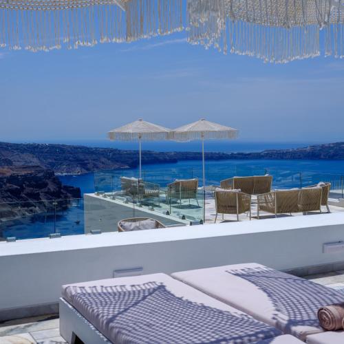 a room with a view of the ocean from a resort at MyBoZer Hotel Kallisto in Imerovigli