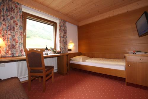 Postel nebo postele na pokoji v ubytování Hotel Landle