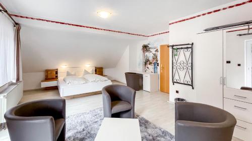 a bedroom with a bed and a table and chairs at Smart Resorts B&B1 BB1 135 in Winterberg
