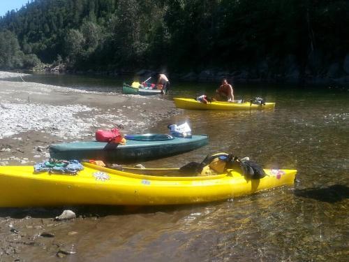 a group of people in kayaks on a river at Bed and Breakfast Du Repos in Saint Quentin