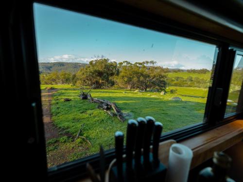 a window with a view of a field of grass at Heyscape Toodyay in Toodyay