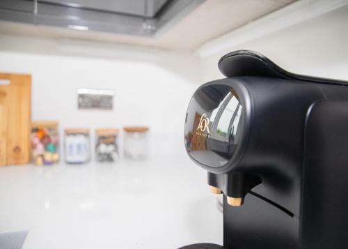 a close up of a hair dryer in a room at 4x Bed Luxurious Home With a View in Downham Market