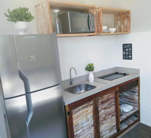 Kuchyň nebo kuchyňský kout v ubytování Residencial Vila das Canoas