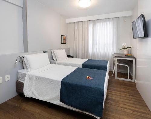 En eller flere senge i et værelse på Tropikalya Prime Hotel