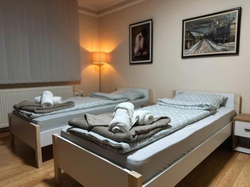 Postel nebo postele na pokoji v ubytování Royal Apartmani