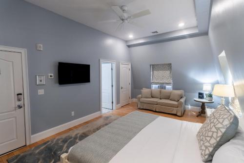 a living room with a large bed and a couch at The Outlook Inn in Newport