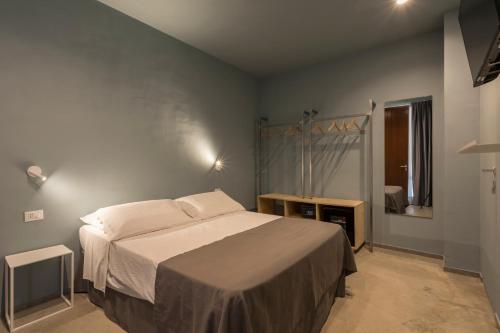 a bedroom with a bed in a room at LELE' Guesthouse in Scoglitti