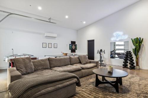 a living room with a couch and a table at Modern Industrial-Near Old Town in Scottsdale