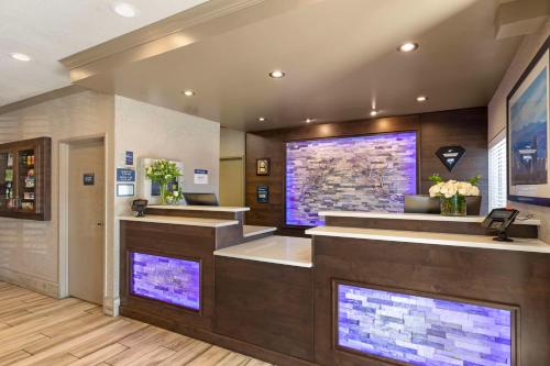a lobby with a hair salon with purple lights at Best Western Greeley in Greeley