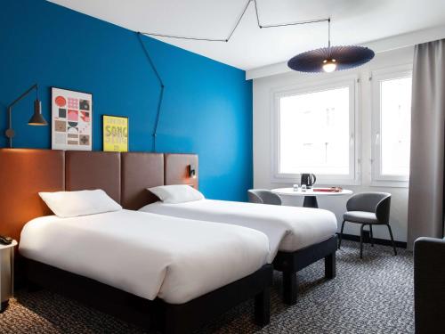 Postel nebo postele na pokoji v ubytování ibis Lausanne Centre