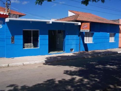 a blue building on the side of a street at Pousada Azul in Jaguarão