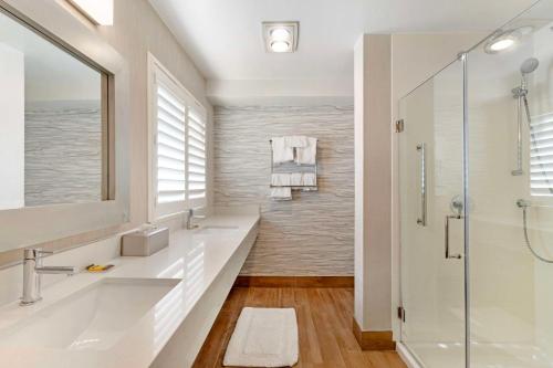 a bathroom with a sink and a shower at Best Western Plus Novato Oaks Inn in Novato