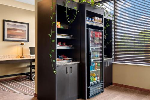 a refrigerator with drinks inside of it in a room at Best Western Paradise Inn in Savoy