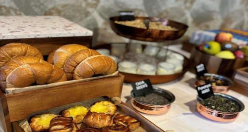a table topped with bread and other food items at Best Western Frodsham Forest Hills Hotel in Frodsham