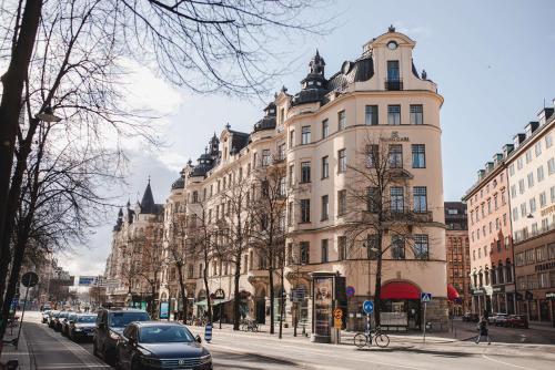 a tall building on a city street with cars parked at Hotel Kung Carl, WorldHotels Crafted in Stockholm