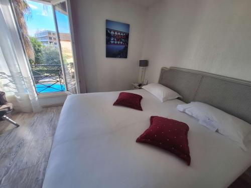 Un ou plusieurs lits dans un hébergement de l'établissement Best Western L'Orangerie