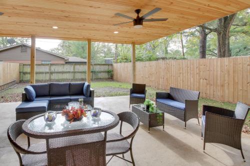 a patio with a couch and chairs and a table at Spacious Little Rock Home with Patio - 9 Mi to Dtwn! in Little Rock