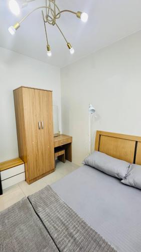 Ένα ή περισσότερα κρεβάτια σε δωμάτιο στο 3BR - Stylish Condo Serenity