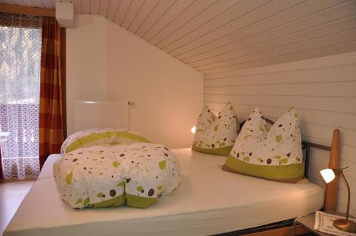 a bedroom with two beds with pillows on it at Ferienwohnung Artur Wieser in Sankt Jakob in Defereggen