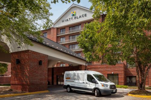 a white van parked in front of a building at Hyatt Place Sterling Dulles Airport North in Sterling