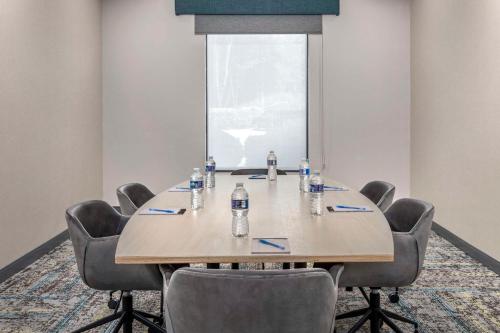 a conference room with a wooden table and chairs at Hampton Inn Birmingham I-65/Lakeshore Drive in Birmingham