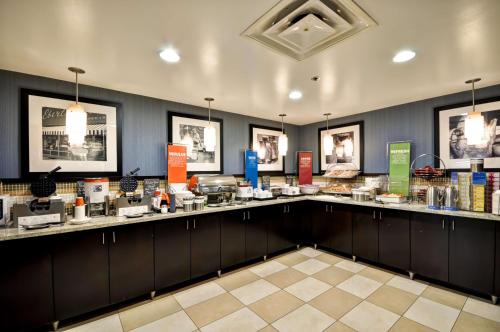 a room with a counter with a lot of food at Hampton Inn Columbus/Dublin in Dublin