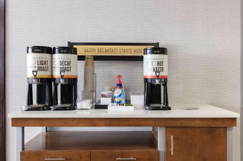 a counter with threebeer bottles on top of it at Hampton Inn Columbus/Dublin in Dublin