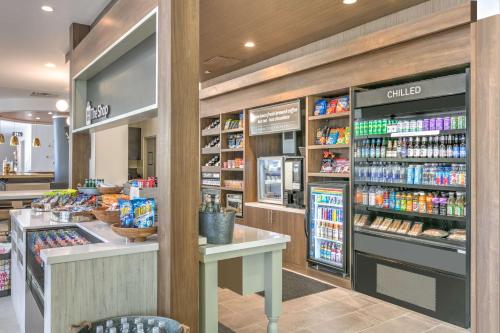 a store with a counter with food and drinks at Hilton Garden Inn Dallas Arlington in Arlington
